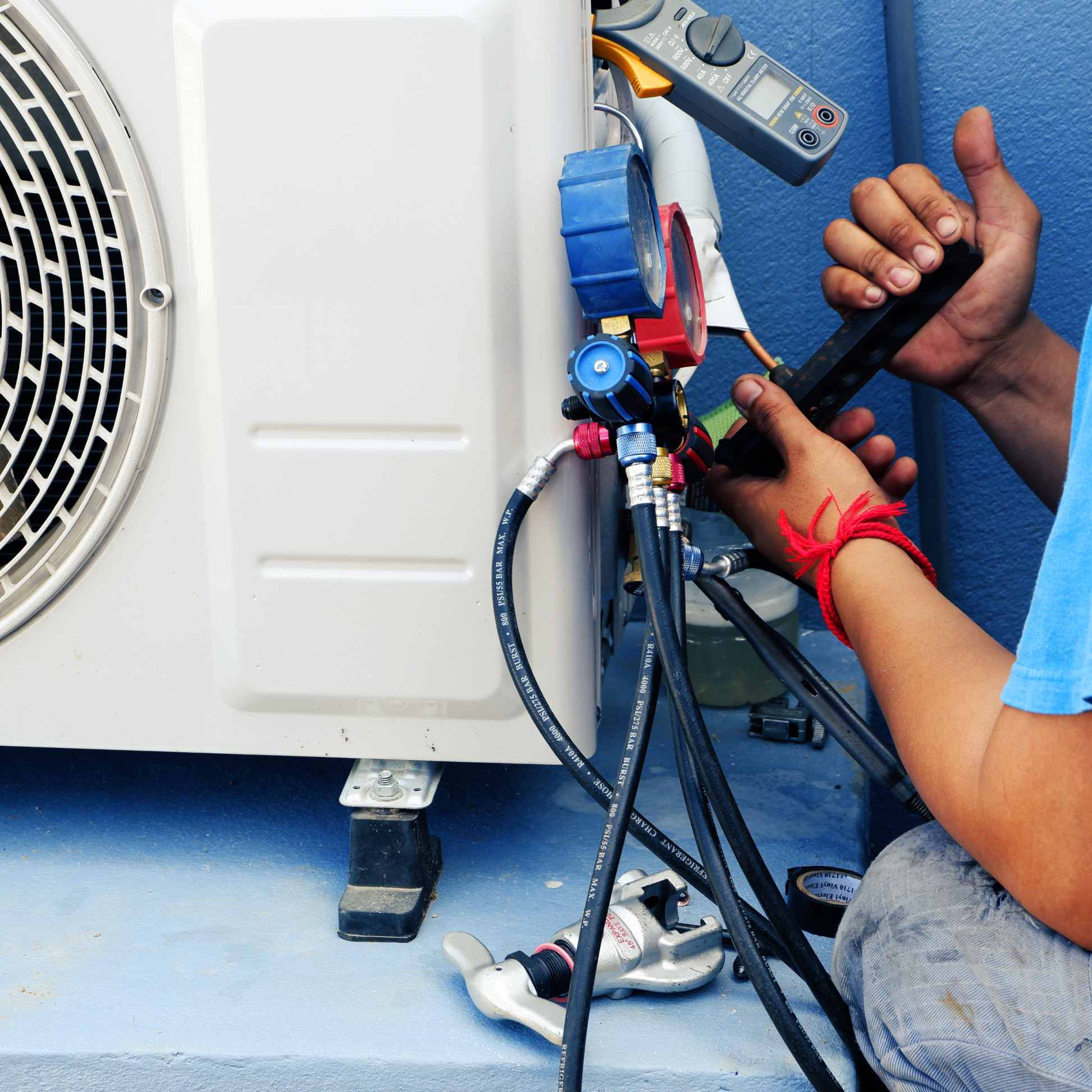 Air Conditioning Technician is Repairing air conditioner tucson az