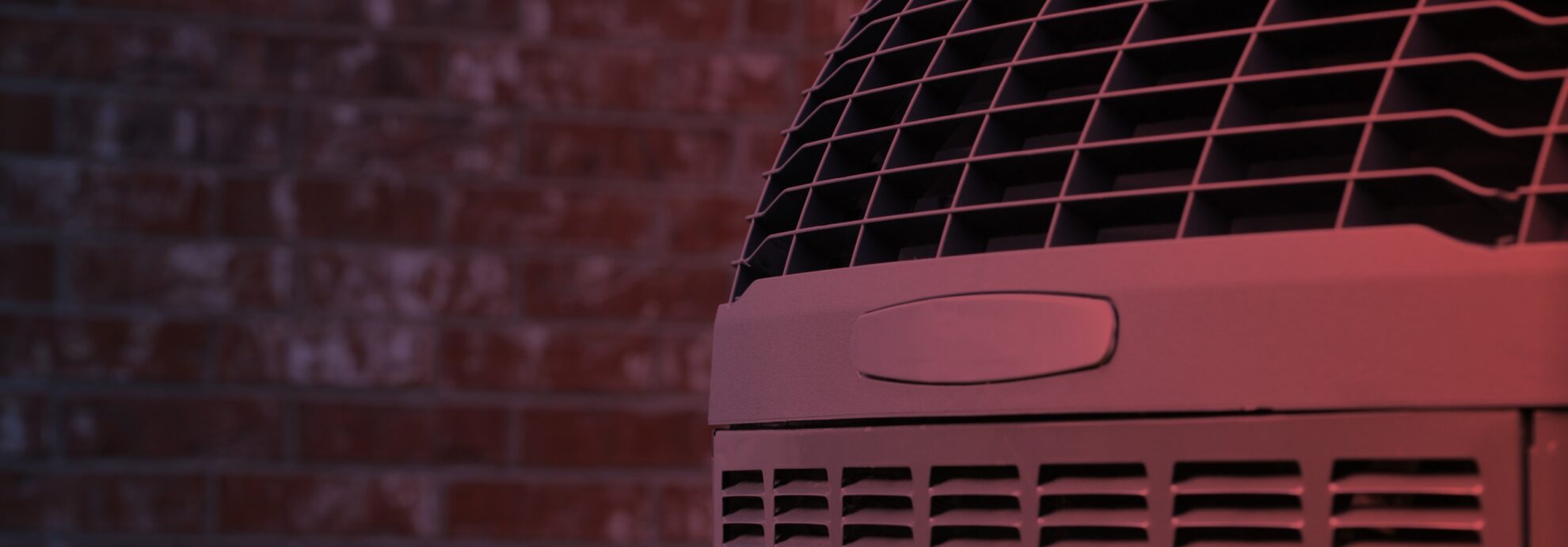 Close up shot of High efficiency modern AC heater unit on brick wall background tucson az